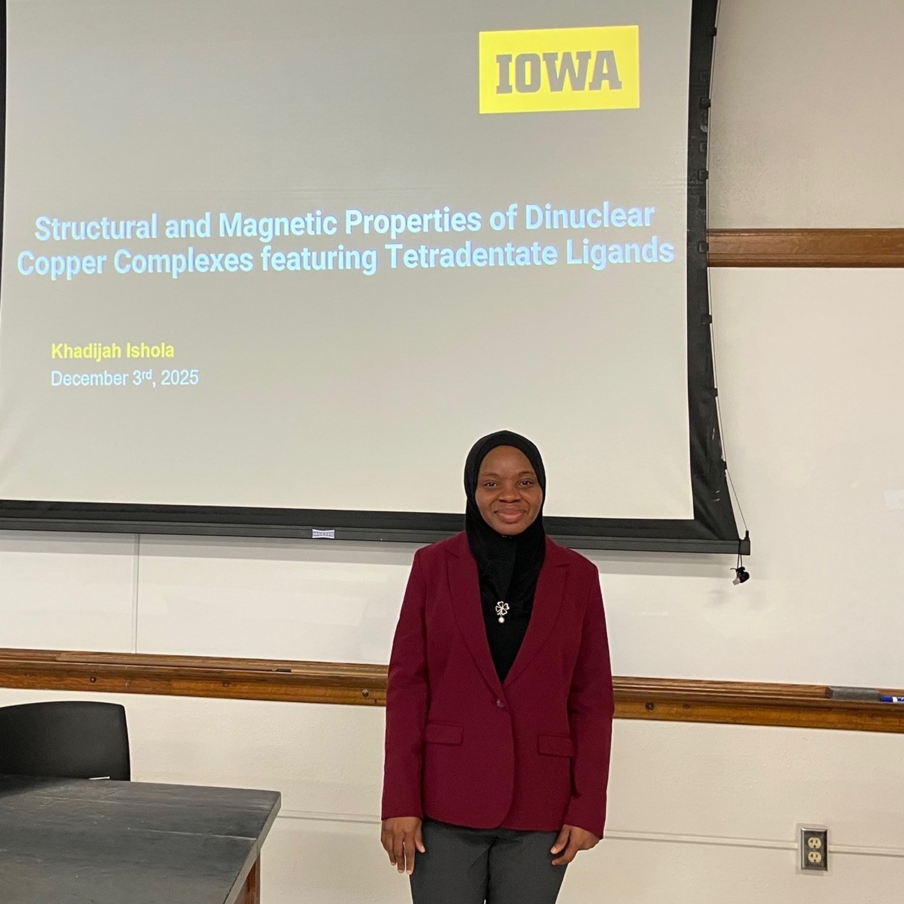 Khadijah standing in front of the lecture hall.