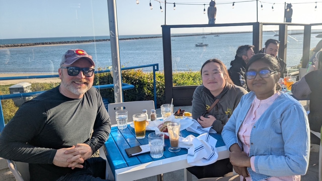 SRD, Balaka, and Mai Yer having dinner on the pacific coast.
